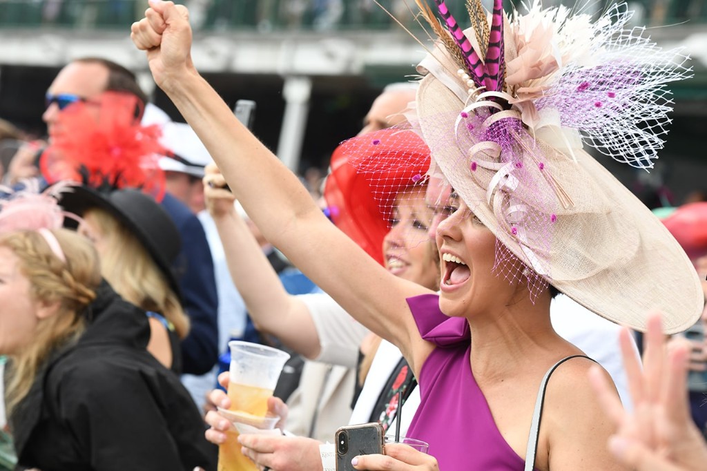 Festive crowd cheering at the Kentucky Derby