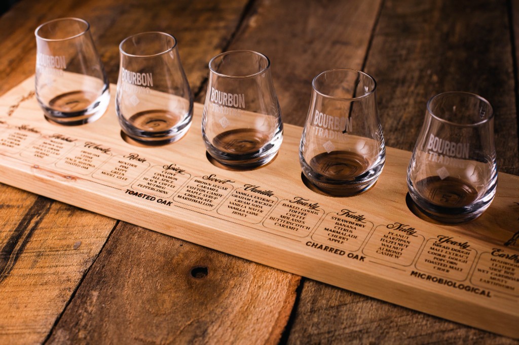 Bourbon tasting flight board with flavor profiles