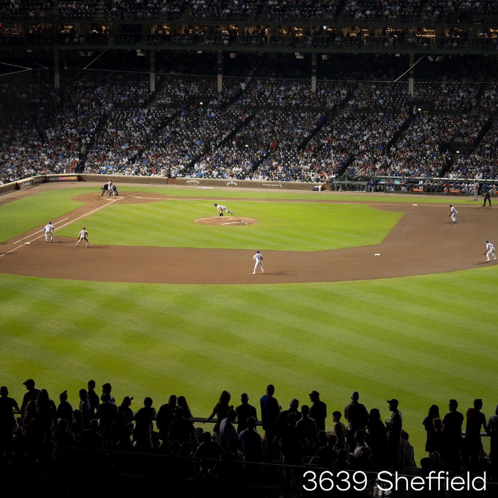 Wrigley Field rooftop view under stadium lights